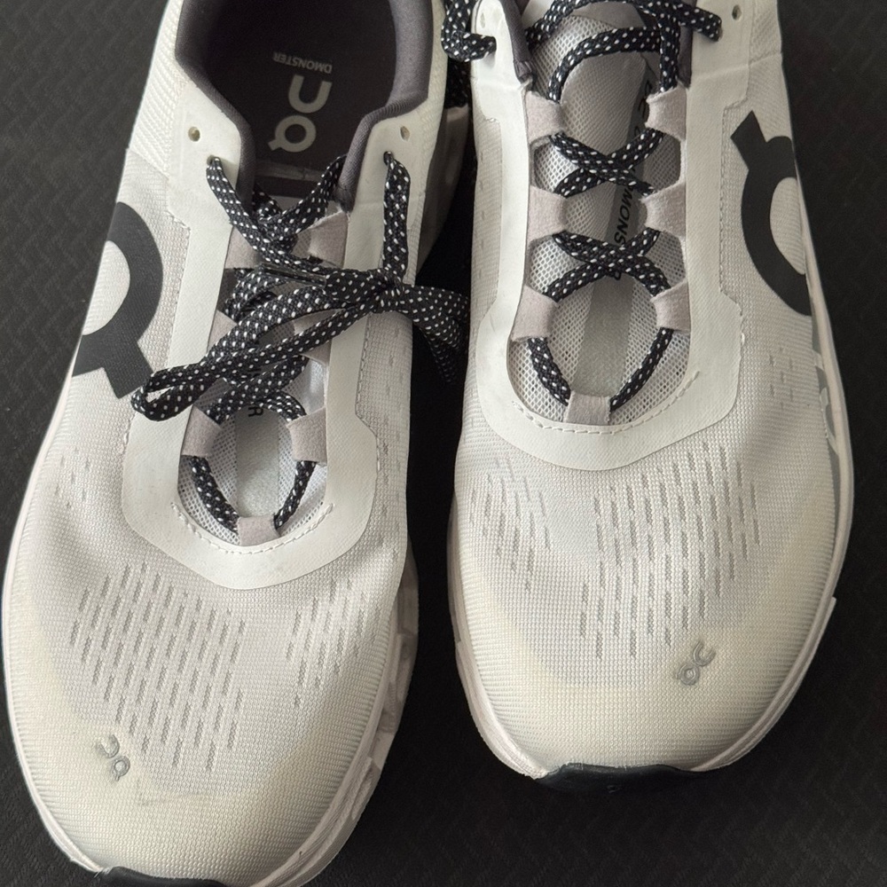 On Running White and Black Athletic Shoes